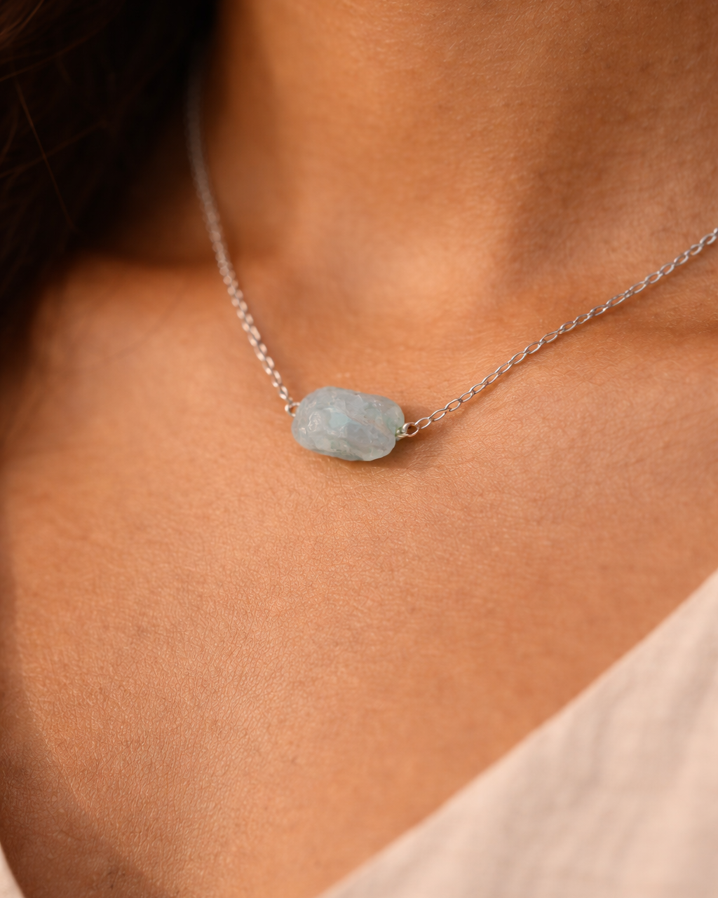close up of natural aquamarine crystal pendant necklace rex stones