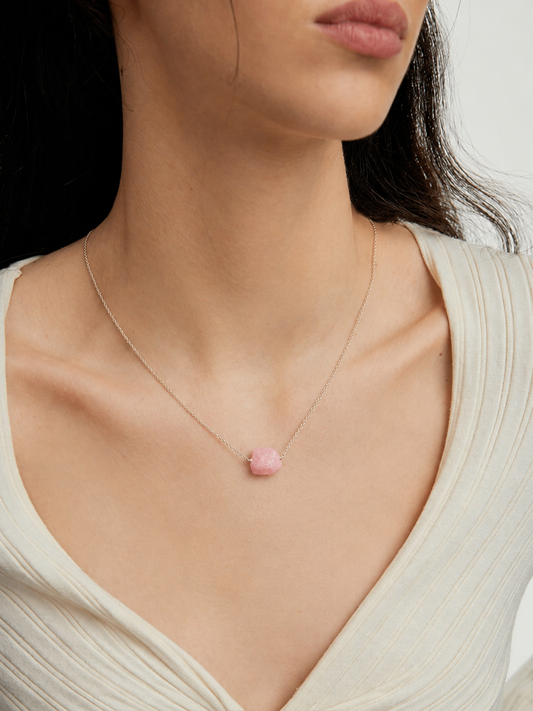 person wearing natural rose quartz raw stone necklace rex stones