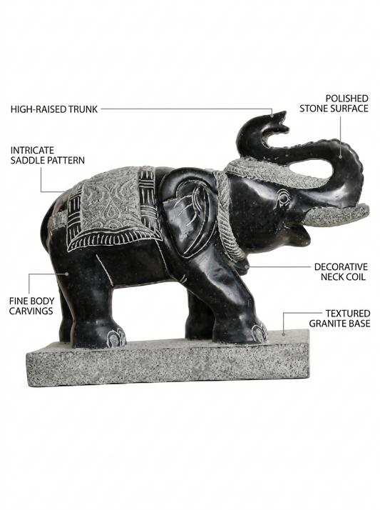 Hand-carved 1.5 ft temple guardian elephant statue in natural stone, product view 2 highlighting the animal form and carved details.
