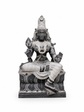 A dark gray and silver stone statue of a seated Hindu deity with ornate carvings, shown against a plain white background.