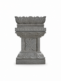 A gray stone decorative pedestal with carved floral and lotus motifs, isolated on a white background.