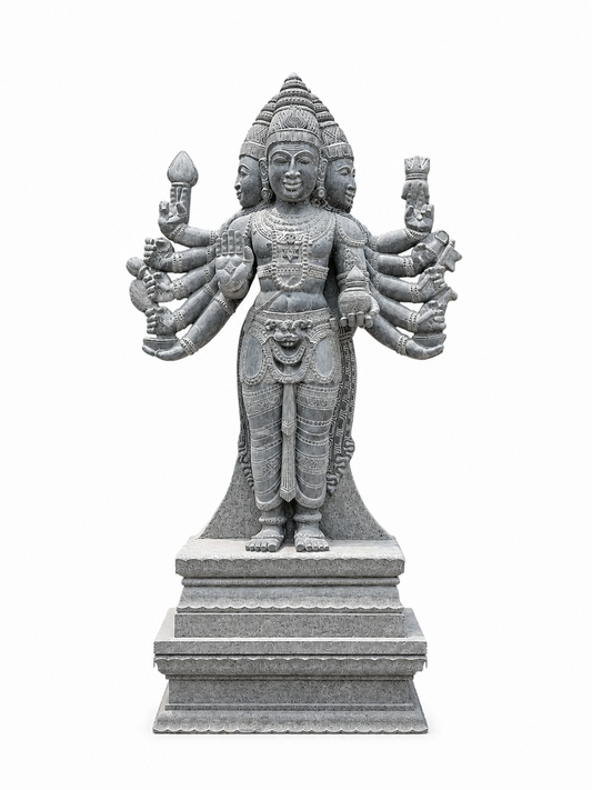 A gray stone statue of a multi-armed Hindu deity standing on a tiered pedestal, isolated on a white background.