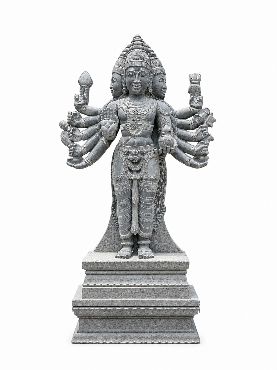 A gray stone statue of a multi-armed Hindu deity standing on a tiered pedestal, isolated on a white background.