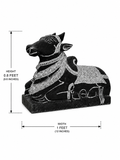 A black stone-style reclining cow figurine with carved light detailing, shown on a white background with dimension arrows indicating height 0.8 feet (24.