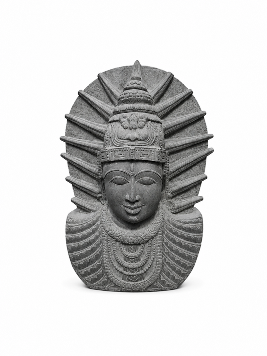 A gray stone sculpture of a stylized face with a crown and radiating halo-like rays, centered on a plain white background.