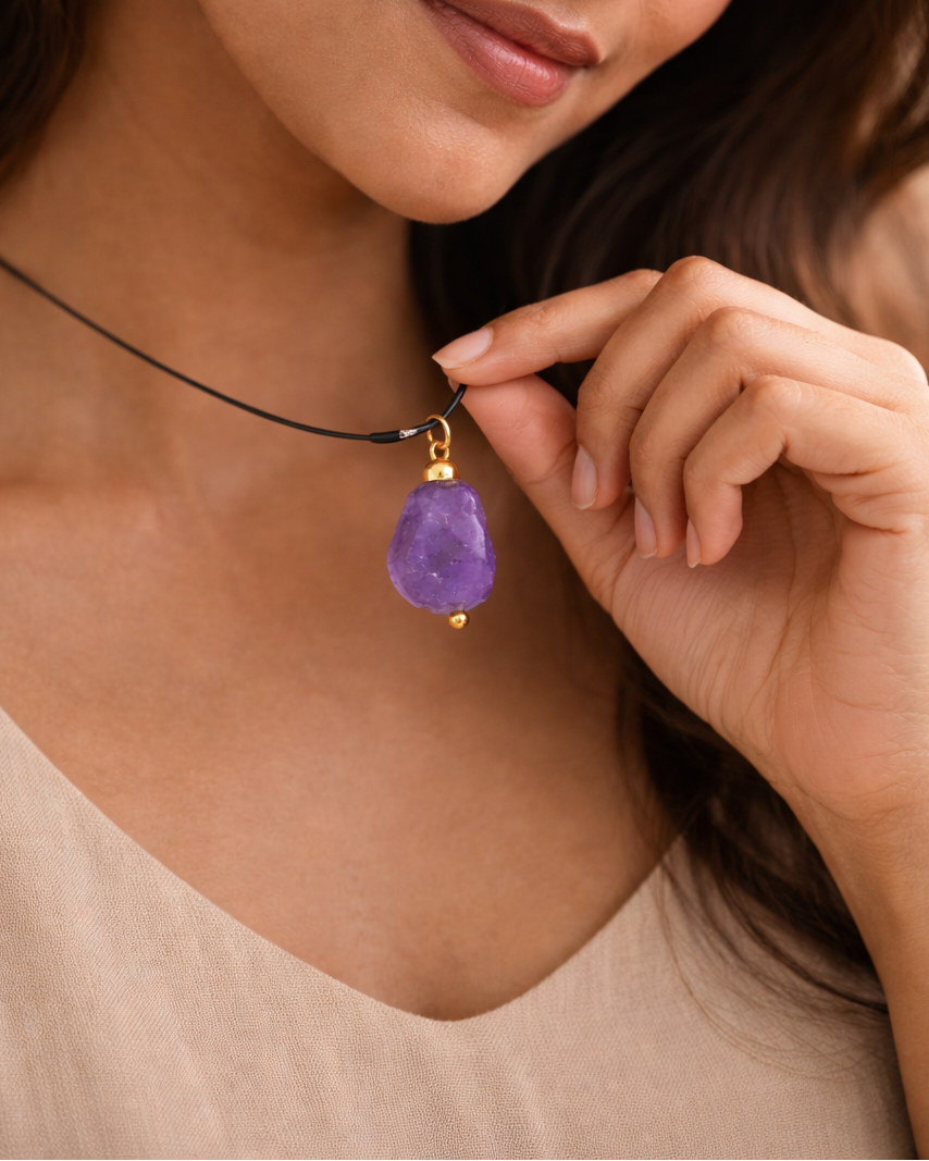 Handcrafted raw amethyst wire wrap necklace black cord lifestyle shot