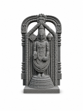 A gray stone or concrete sculpture of a Hindu deity standing inside an ornate arched frame, isolated on a white background.