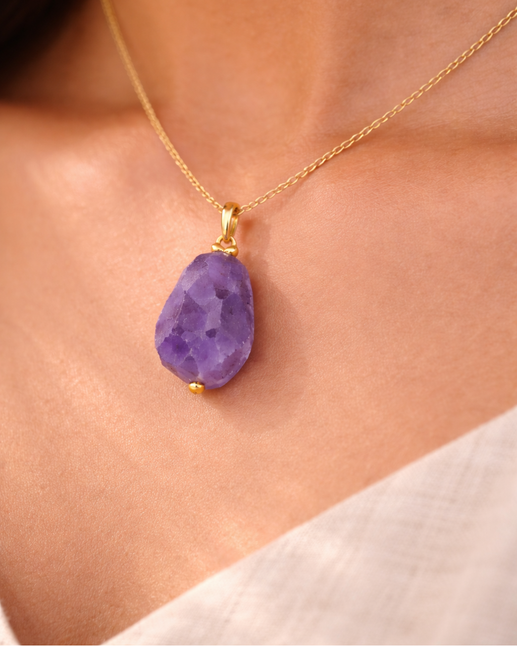 Close-up of purple amethyst wire wrapped gemstone necklace