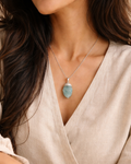 Woman wearing aquamarine necklace stainless steel chain