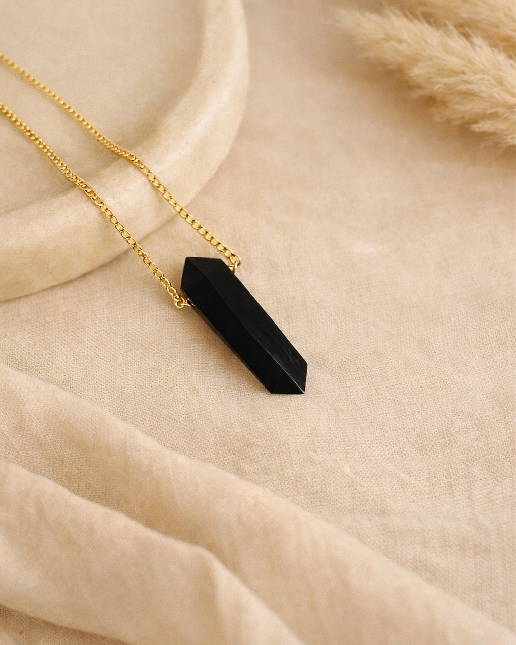 black onyx mens bullet pendant on chain showing deep black stone