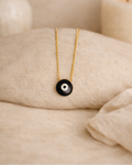 black onyx mens evil eye pendant on chain showing deep black stone