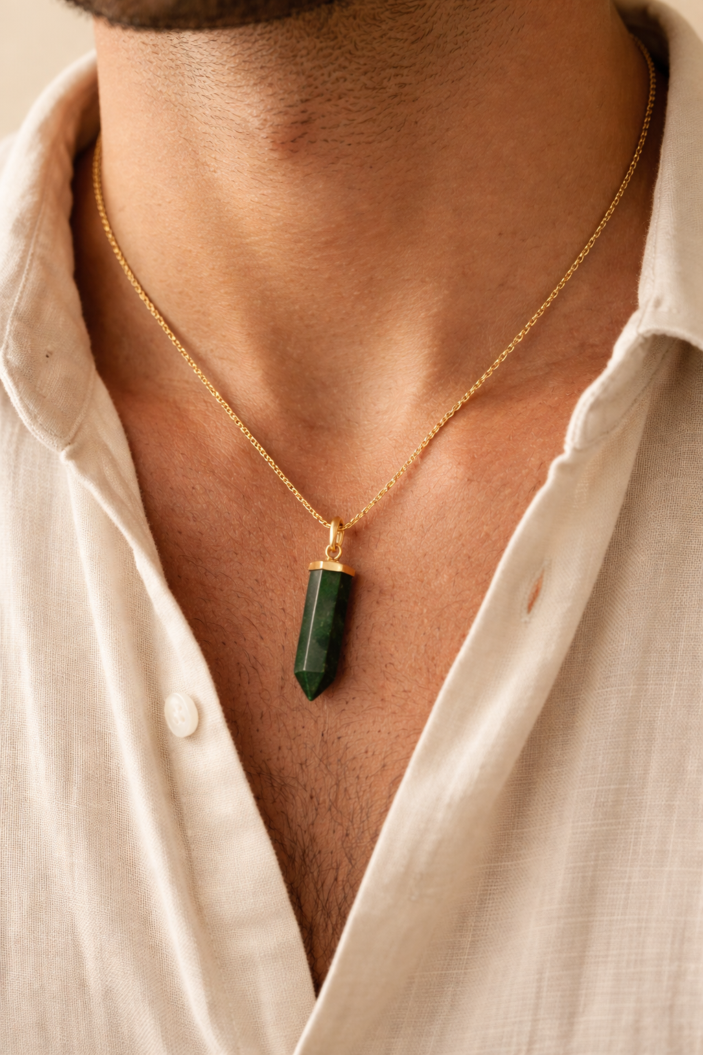 man wearing green aventurine bullet pendant minimal jewelry