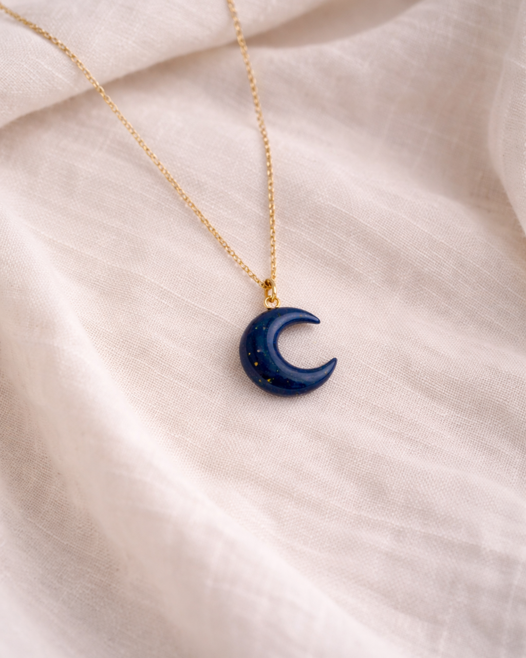 lapis lazuli crescent moon pendant necklace showing deep blue stone texture