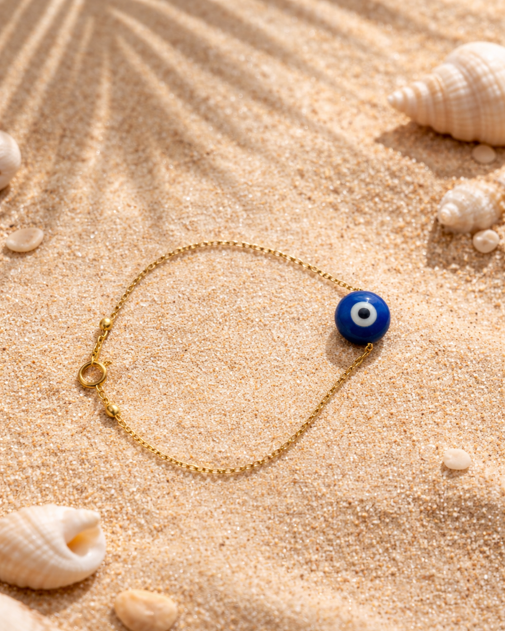 lapis lazuli evil eye bracelet on chain showing deep blue stone