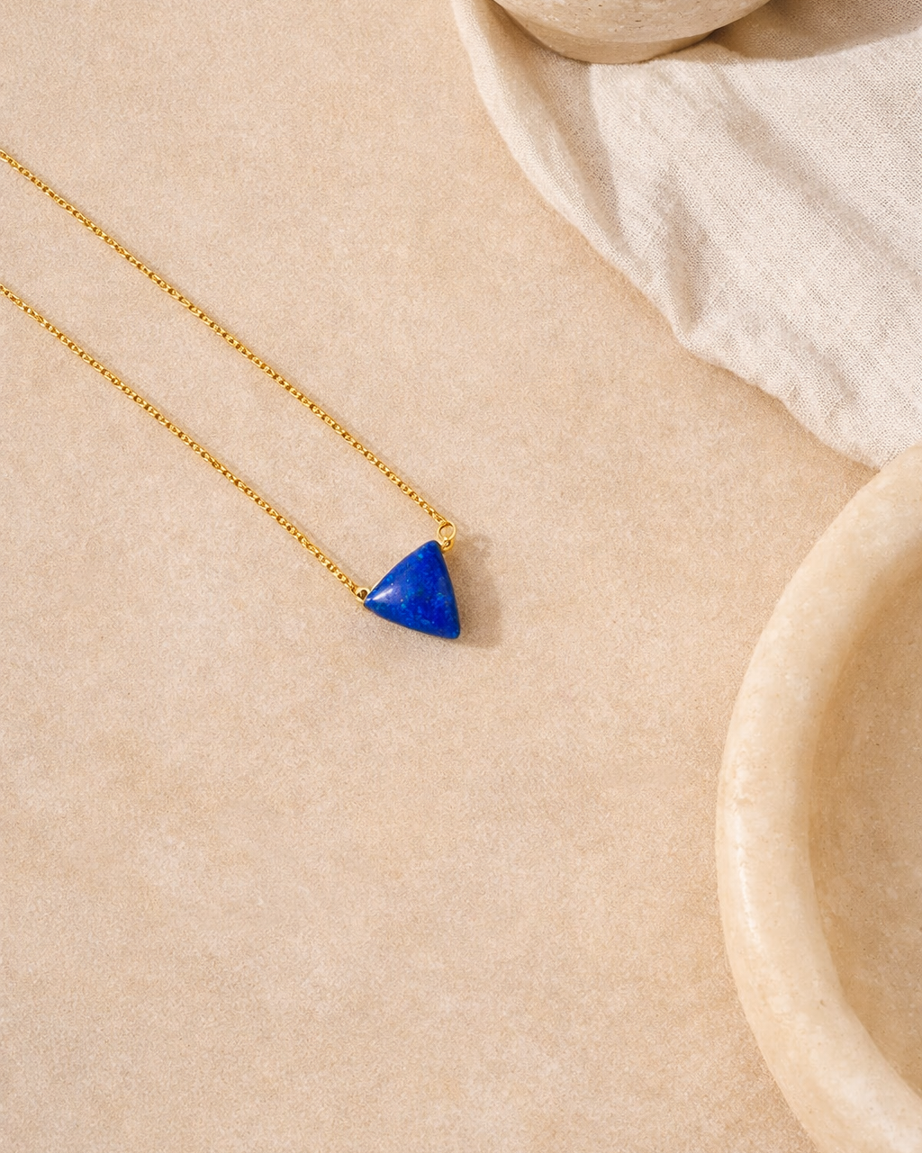 lapis lazuli mens tikona pendant on chain showing deep blue natural stone