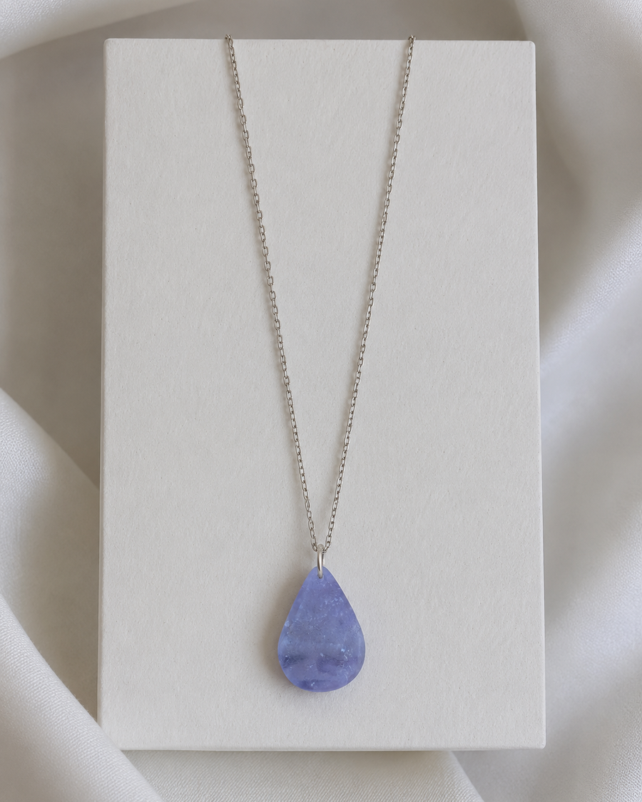 Natural Amethyst teardrop pendant necklace on white display stand