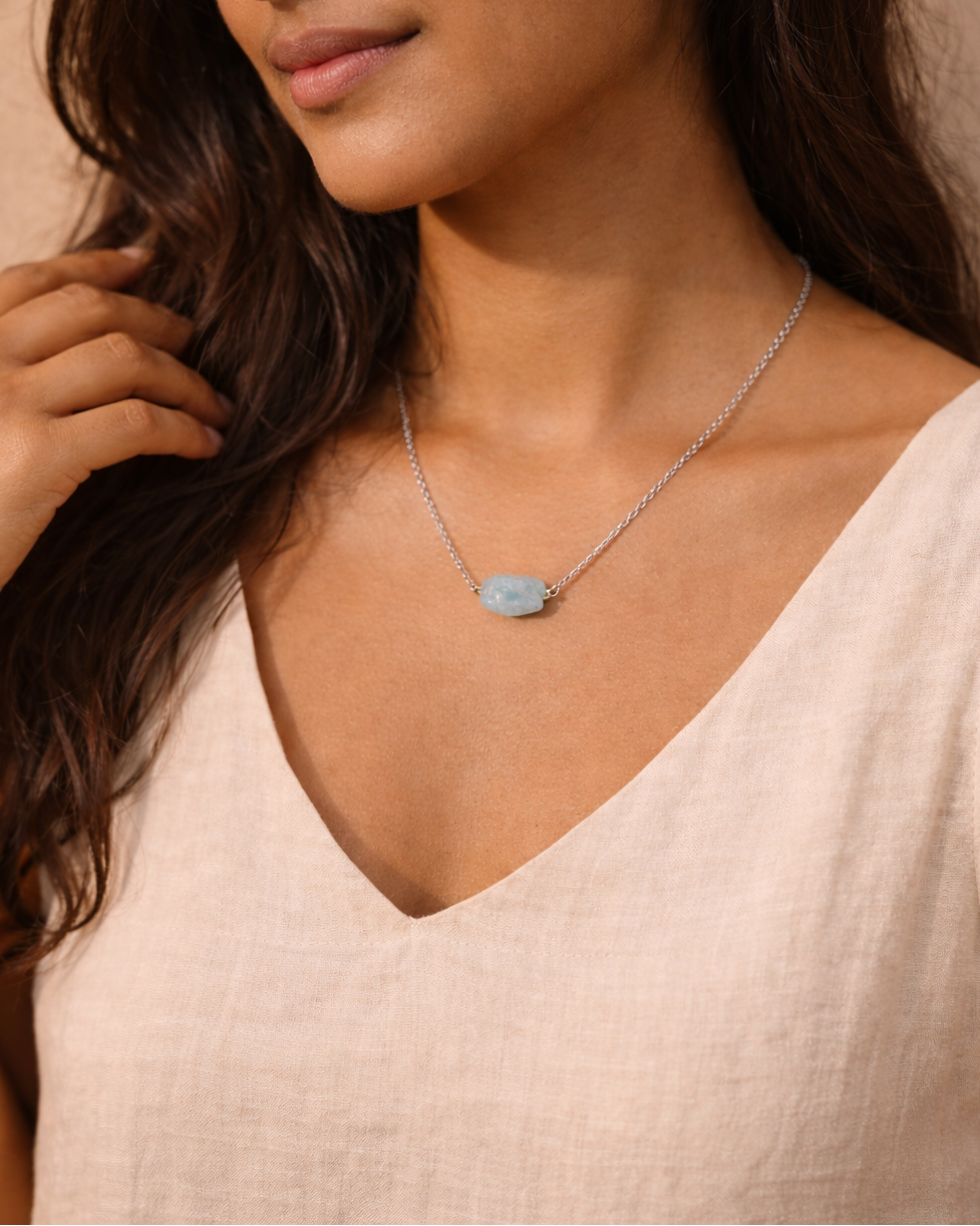 person wearing natural aquamarine crystal pendant necklace rex stones