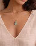person wearing natural aquamarine electroplated stone pendant rex stones