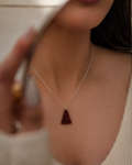 natural garnet triangle stone pendant necklace on display rex stones