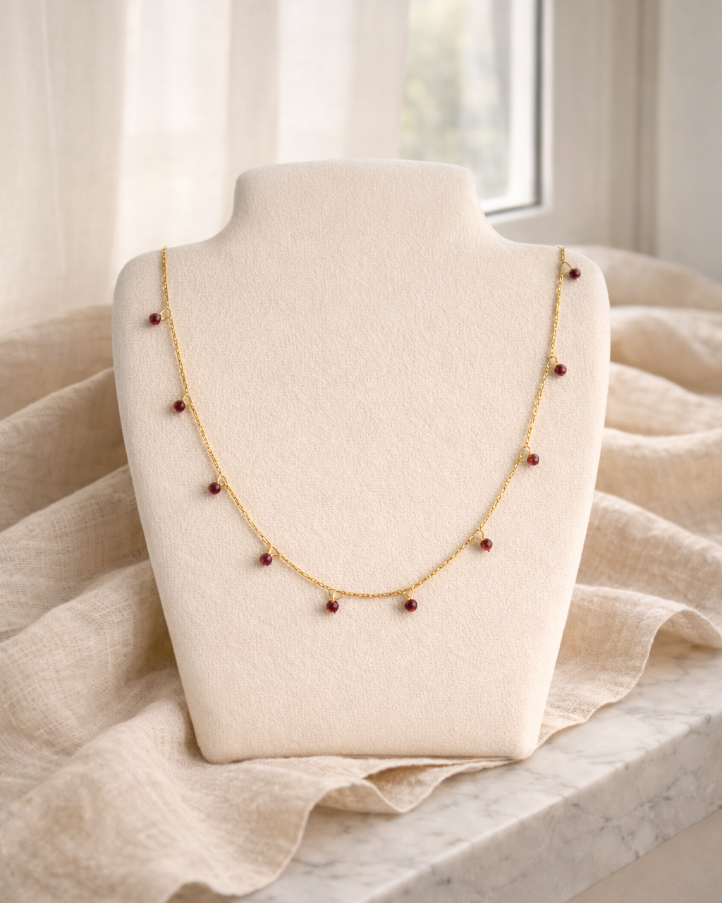 natural garnet bracelet on gold chain showing deep red stone texture