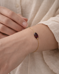 woman wearing natural garnet bracelet minimal elegant jewelry