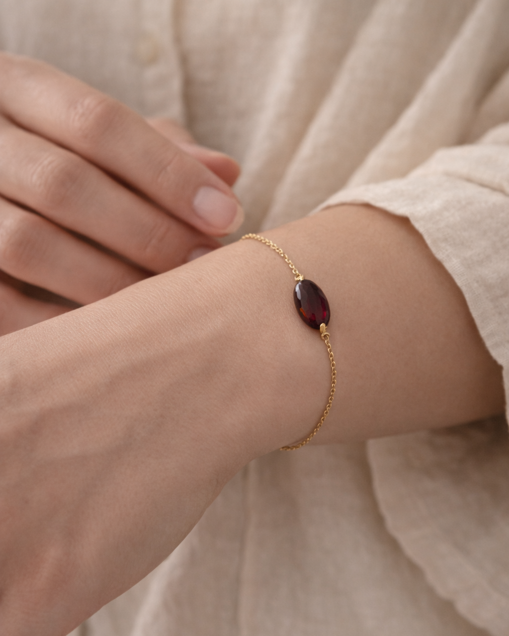 woman wearing natural garnet bracelet minimal elegant jewelry