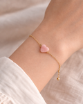 woman wearing pink opal cloud bracelet soft aesthetic minimal jewelry