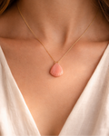 woman wearing pink opal shell pendant minimal jewelry