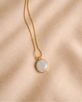 rainbow moonstone oval mens pendant showing natural iridescent white stone