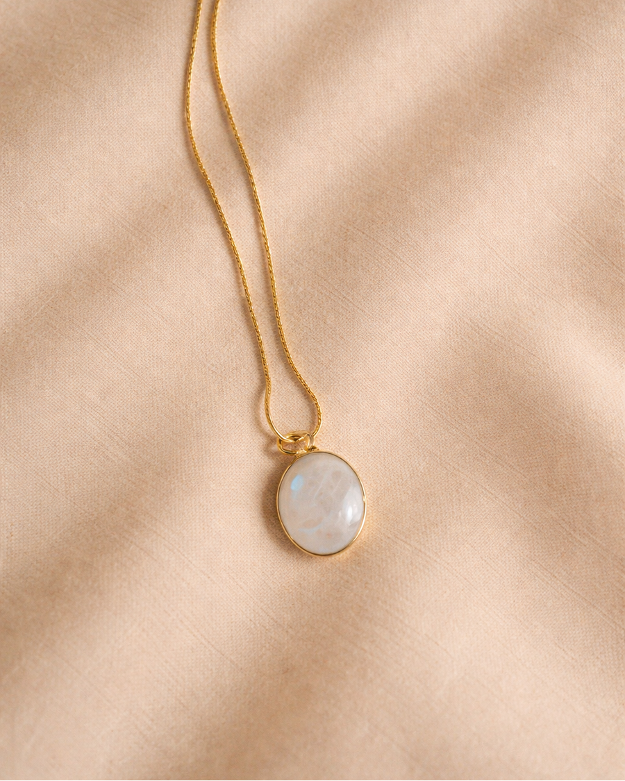 rainbow moonstone oval mens pendant showing natural iridescent white stone