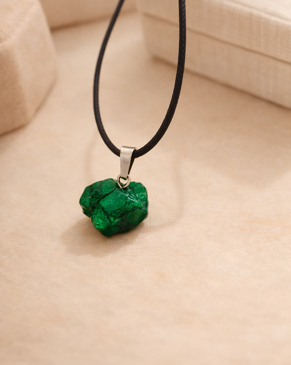 raw malachite pendant necklace showing natural green stone texture