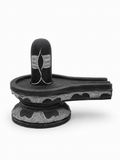 Hand-carved 0.5 ft Third Eye Shiva Lingam statue in natural stone, product view 1 highlighting the sacred carving and form.