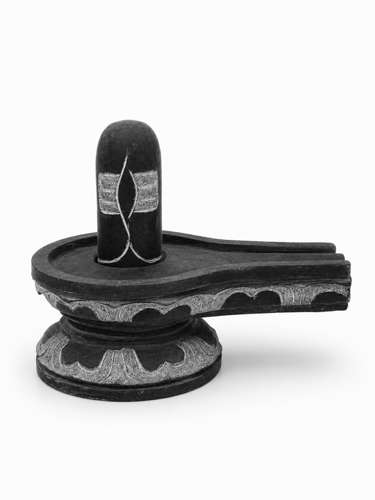 Hand-carved 0.5 ft Third Eye Shiva Lingam statue in natural stone, product view 1 highlighting the sacred carving and form.