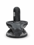 Hand-carved 0.5 ft Third Eye Shiva Lingam statue in natural stone, product view 3 highlighting the sacred carving and form.