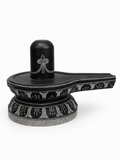 Hand-carved 0.8 ft Tripundra Shiva Lingam statue in natural stone, product view 1 highlighting the sacred markings and form.