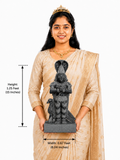 Hand-carved 1.25 ft Ketu Bhagavan Navagraha statue in polished black stone shown with an adult model for scale.