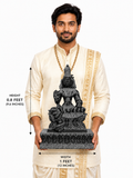 Hand-carved 1.25 ft Parvati Devi statue in polished black stone shown beside an adult model for scale with measurements.