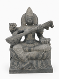 Hand-carved 1.25 ft Saraswathi Devi statue in natural stone, product view 1 highlighting the sculpture and carved details.