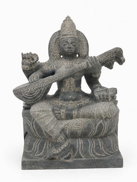 Hand-carved 1.25 ft Saraswathi Devi statue in natural stone, product view 1 highlighting the sculpture and carved details.