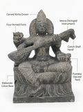 Hand-carved 1.25 ft Saraswathi Devi statue in natural stone, product view 2 highlighting the sculpture and carved details.