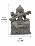 Hand-carved 1.25 ft Saraswathi Devi statue in natural stone, product view 5 highlighting the sculpture and carved details.