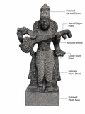 Hand-carved 1.25 ft Saraswati statue in natural stone, product view 2 highlighting the goddess form and carved details.