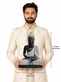 Hand-carved 1.5 ft meditating Buddha statue in polished black stone shown beside an adult model for scale with measurements.