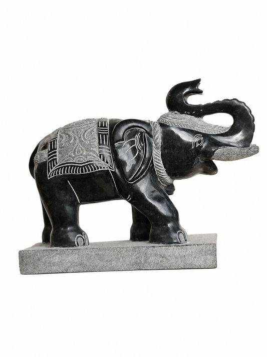 Hand-carved 1.5 ft temple guardian elephant statue in natural stone, product view 1 highlighting the animal form and carved details.