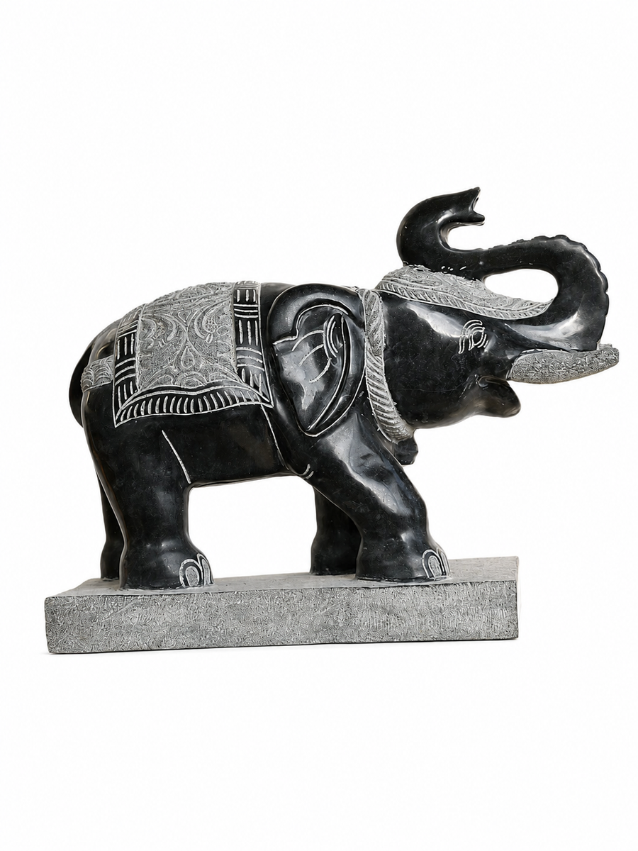 Hand-carved 1.5 ft temple guardian elephant statue in natural stone, product view 1 highlighting the animal form and carved details.