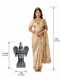 Hand-carved 1.75 ft Garuda Bhagavan statue in polished black stone shown beside an adult model for scale.