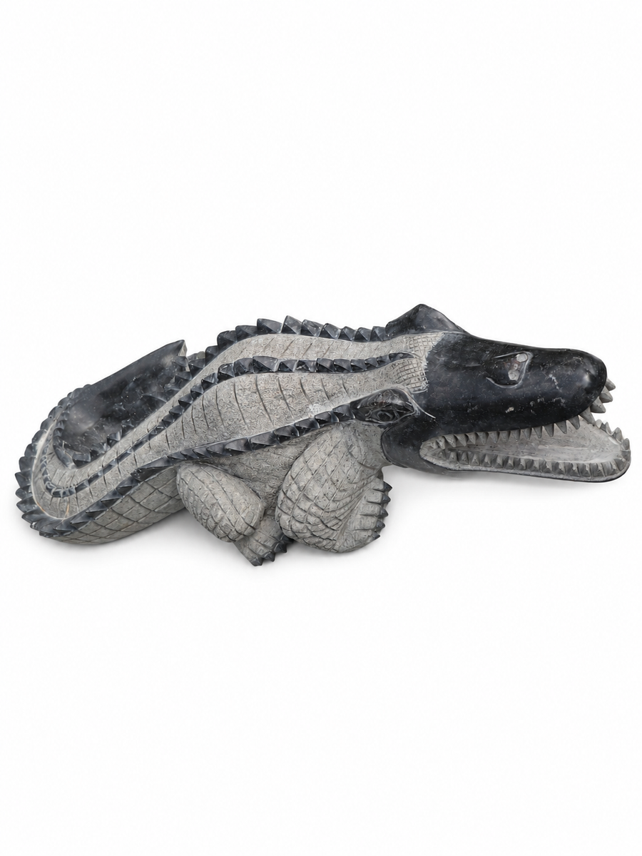 Hand-carved 1.9 ft Crocodile Stone Sculpture on Raised Platform in natural Charnockite stone, product view 1 showing the sculpture and carved details.