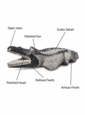 Hand-carved 1.9 ft Crocodile Stone Sculpture on Raised Platform in natural Charnockite stone, product view 2 showing the sculpture and carved details.