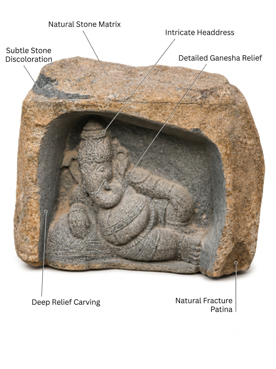 Hand-carved 1.9 ft Ganesha Boulder Statue in natural Charnockite stone, product view 2 showing the sculpture and carved details.