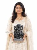 Hand-carved 1 ft Lord Krishna statue in natural stone, product view 5 highlighting the flute-playing form and carved details.